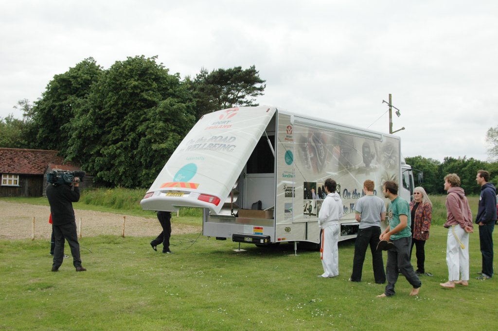 North Nofolk mobile wellbeing vehicle being opened up while TV cameras are filming on the launch